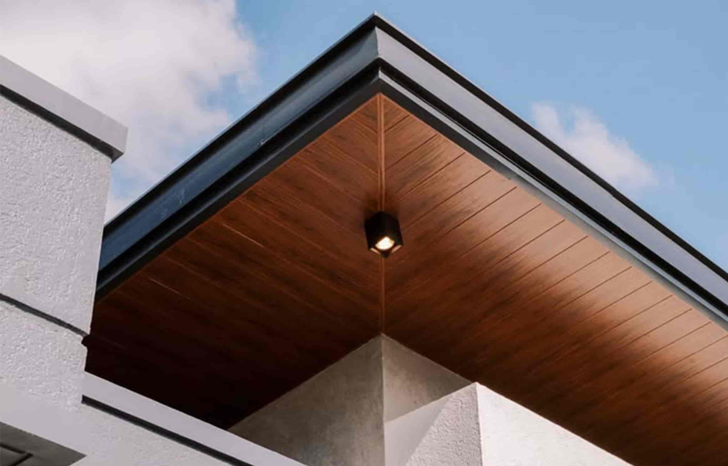 Necowood WPC soffit panel installed on a covered outdoor walkway ceiling